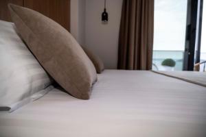 Postel nebo postele na pokoji v ubytování RiA BLU DELUXE HOTEL