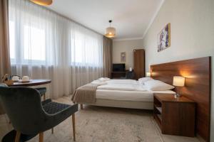 Posteľ alebo postele v izbe v ubytovaní Hotel Polonia