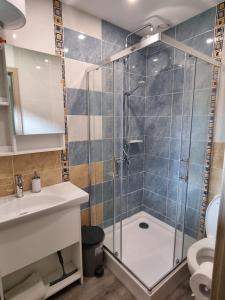 a bathroom with a shower and a sink and a toilet at Privati valda in Šventoji +24 photos