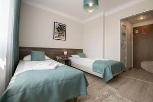 Posteľ alebo postele v izbe v ubytovaní Hotel Polonia