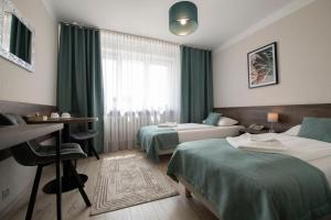 Posteľ alebo postele v izbe v ubytovaní Hotel Polonia