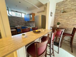 Kuchyň nebo kuchyňský kout v ubytování Mondello Telemaco Beach