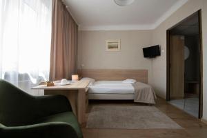Posteľ alebo postele v izbe v ubytovaní Hotel Polonia