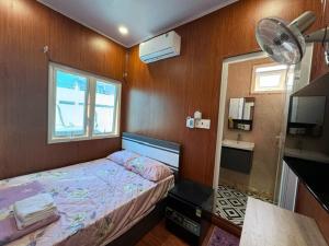 Postel nebo postele na pokoji v ubytování An Chi Hotel