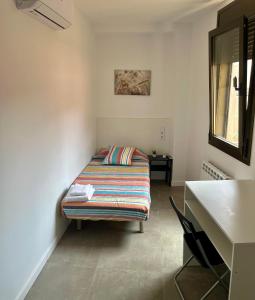 Postel nebo postele na pokoji v ubytování Hostal La Masia