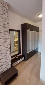 a living room with a large mirror and a counter at Apartments Danilo Kažanegra in Sveti Stefan