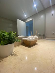 a bathroom with a tub and a large mirror at Casa lagoon & pool, Alcazaba by Casa del sol HR in Casares