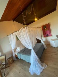 Postel nebo postele na pokoji v ubytování Pousada Morro dos Navegantes