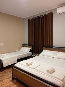 Postel nebo postele na pokoji v ubytování Eja Mare Guest House