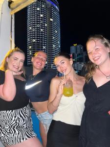 a group of women posing for a picture at a party at Bondi Backpackers Nhatrang in Nha Trang
