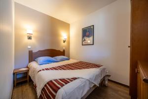 Postel nebo postele na pokoji v ubytování Résidence Pierre & Vacances Les Trois Domaines