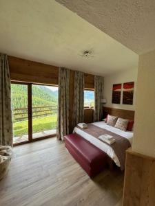 Postel nebo postele na pokoji v ubytování Edelweiss Hotel Champoluc