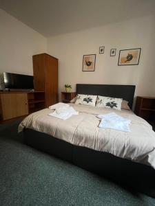 Postel nebo postele na pokoji v ubytování Apartmány BAROKO