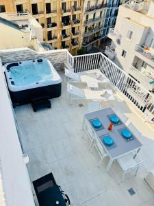 an overhead view of a hot tub on a balcony at Poseidon Court Penthouse SUPERIOR in St Paul's Bay +27 photos