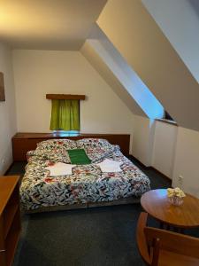 Postel nebo postele na pokoji v ubytování Apartmány BAROKO