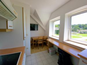 Televízia a/alebo spoločenská miestnosť v ubytovaní Apartments in Grüner Umgebung