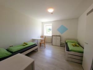 Posteľ alebo postele v izbe v ubytovaní Apartments in Grüner Umgebung