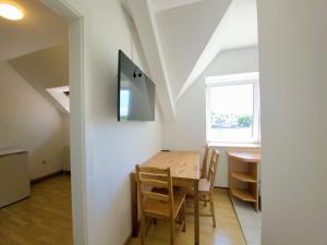 Televízia a/alebo spoločenská miestnosť v ubytovaní Apartments in Grüner Umgebung