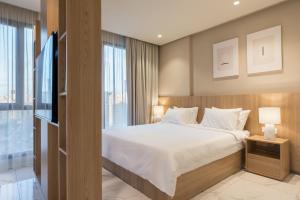 Voodi või voodid majutusasutuse The Code Residence - ذا كود ريزيدنس toas