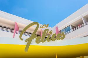 a building with a sign that reads los angeles at Los Felices Ibiza in San Antonio Bay