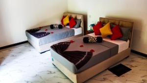 Letto o letti in una camera di Sigiri Thilanka Rest Sigiriya