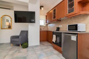 Kuchyň nebo kuchyňský kout v ubytování Maria Hotel
