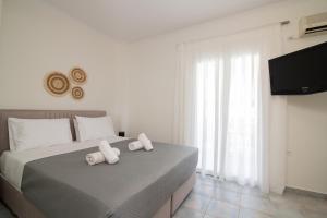 Postel nebo postele na pokoji v ubytování Maria Hotel