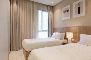 Voodi või voodid majutusasutuse The Code Residence - ذا كود ريزيدنس toas