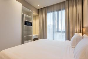 Voodi või voodid majutusasutuse The Code Residence - ذا كود ريزيدنس toas