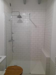 a bathroom with a shower with a toilet and a sink at Vacation Rental in Ambleville