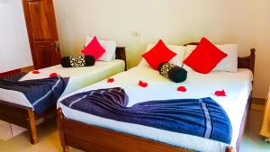 Letto o letti in una camera di Sigiri Thilanka Rest Sigiriya