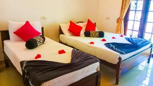 Letto o letti in una camera di Sigiri Thilanka Rest Sigiriya