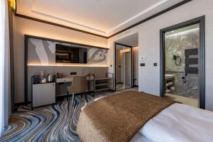 Postel nebo postele na pokoji v ubytování Hotel Debrecen