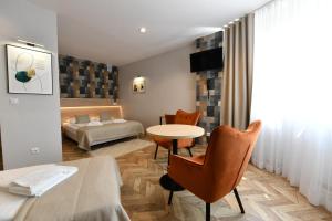 Posteľ alebo postele v izbe v ubytovaní Hotel Polonia