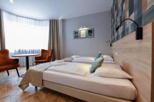 Posteľ alebo postele v izbe v ubytovaní Hotel Polonia