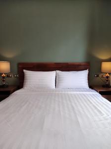 Łóżko lub łóżka w pokoju w obiekcie Kenting Cozy B&B