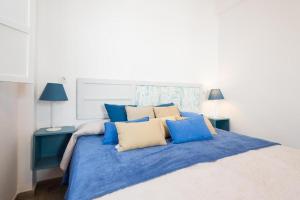 Ein Bett oder Betten in einem Zimmer der Unterkunft Blue Beach House ATICO CON TERRAZA