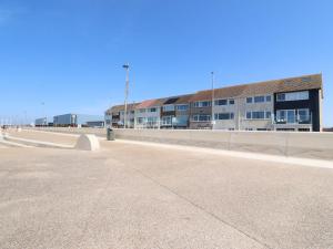 an empty parking lot in front of a building at 26 North Promenade in Cleveleys