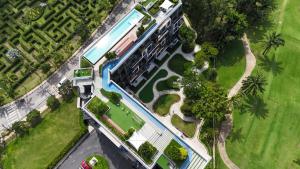 an overhead view of a building with a swimming pool at Sky Park Laguna 1 bedroom Golf View in Bang Tao Beach