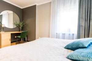 Posteľ alebo postele v izbe v ubytovaní Apartament przy Starówce