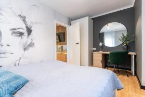 Posteľ alebo postele v izbe v ubytovaní Apartament przy Starówce