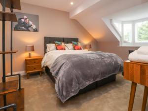 a bedroom with a bed and a window at The Oakroyd in Carnforth