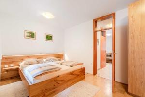 Postel nebo postele na pokoji v ubytování Apartma Miranda