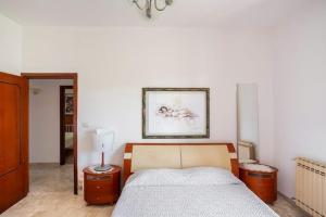 Postel nebo postele na pokoji v ubytování guesthouseminturnoit Lucia Sparagna