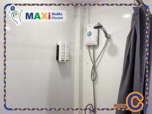 a shower in a bathroom with a shower head at MAXi MaMa House in Bangkok +44 photos