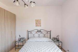 Postel nebo postele na pokoji v ubytování guesthouseminturnoit Lucia Sparagna