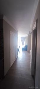 a hallway with a door and a dog in a room at Apartamentos Green Park Tenerife in San Miguel de Abona