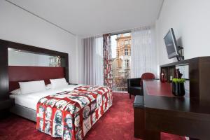Postel nebo postele na pokoji v ubytování ARCOTEL Velvet Berlin
