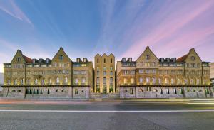 a row of buildings on the side of a street at ARCOTEL Camino Stuttgart in Stuttgart