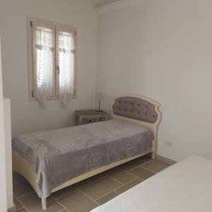 Ένα ή περισσότερα κρεβάτια σε δωμάτιο στο House Amedeo di Savoia Deluxe